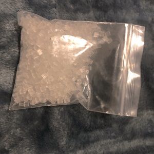 A little bag of earring backs.